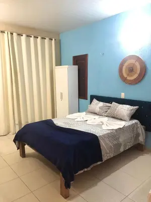 Uma cama ou camas num quarto em Pousada Vila do Pôr do Sol Canoa Quebrada
