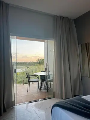 Uma cama ou camas num quarto em Villa brisa icaraizinho suíte premium 1 andar