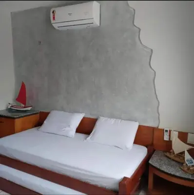 Uma cama ou camas num quarto em Condomínio Sables Blanc
