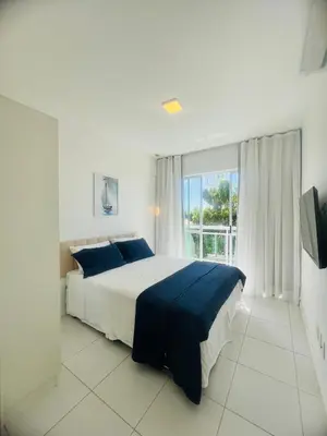 Uma cama ou camas num quarto em Cobertura Palm Beach Porto das Dunas