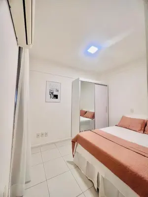 Uma cama ou camas num quarto em Cobertura Palm Beach Porto das Dunas