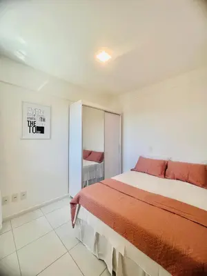 Uma cama ou camas num quarto em Cobertura Palm Beach Porto das Dunas