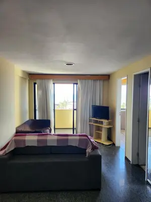 Uma televisão e/ou sistema de entretenimento em Apartamento na Praia de Iracema com vista mar