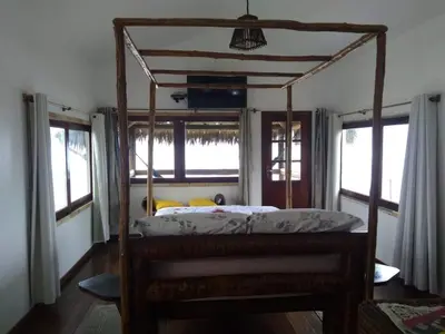Uma cama ou camas num quarto em Pousada TERRA NOVA