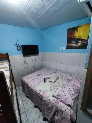 Uma cama ou camas num quarto em Pousada Terra do Sol