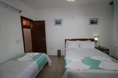 Uma cama ou camas num quarto em Hotel Pousada 360