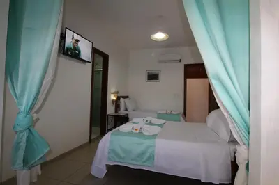Uma cama ou camas num quarto em Hotel Pousada 360