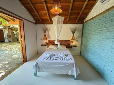 Uma cama ou camas num quarto em Villa Atlântic Icaraizinho 700 m da praia