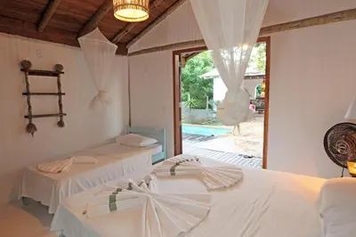 Uma cama ou camas num quarto em Villa Atlântic Icaraizinho 700 m da praia