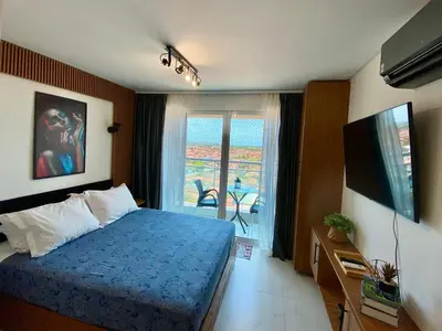 Uma cama ou camas num quarto em Aurora Fortaleza