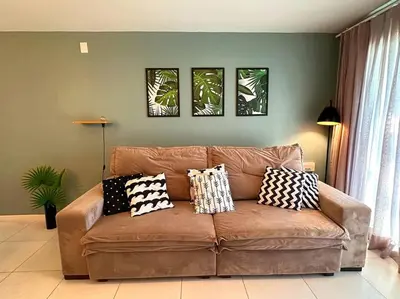 Uma área de estar em Apartamento Paradise Golf Ville
