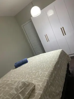 Uma cama ou camas num quarto em apartamento completo praia do futuro fortaleza