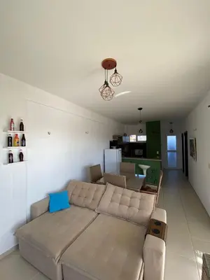 Uma área de estar em Apartamento pé na areia na Taiba