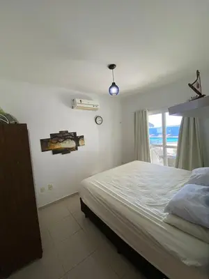 Uma cama ou camas num quarto em Apartamento pé na areia na Taiba