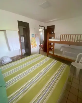 Uma cama ou camas num quarto em Paraíso no Porto das Dunas!