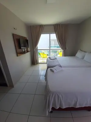 Uma cama ou camas num quarto em Terraço Hotel Lagoinha
