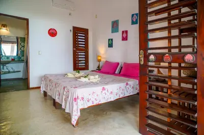 Uma cama ou camas num quarto em Pousada Jangada Prea
