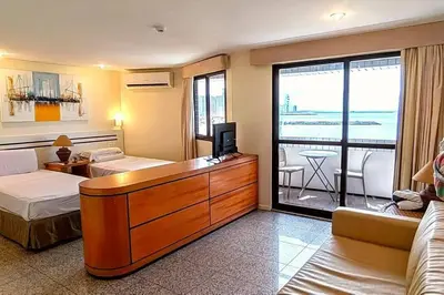 Uma cama ou camas num quarto em Flat no melhor da Beira-mar de Fortaleza