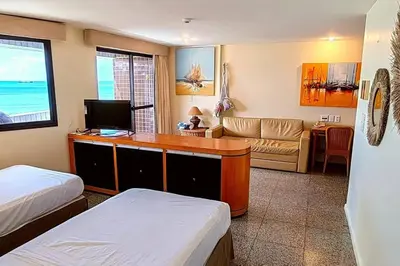 Uma cama ou camas num quarto em Flat no melhor da Beira-mar de Fortaleza