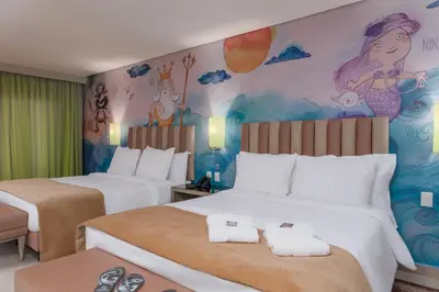 Uma cama ou camas num quarto em Vila Galé Collection Sunset Cumbuco