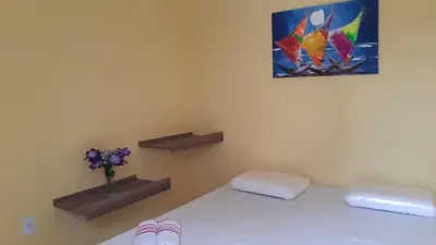 Uma cama ou camas num quarto em Cris hospedagem