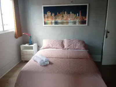 Uma cama ou camas num quarto em Pousada Areia da Praia