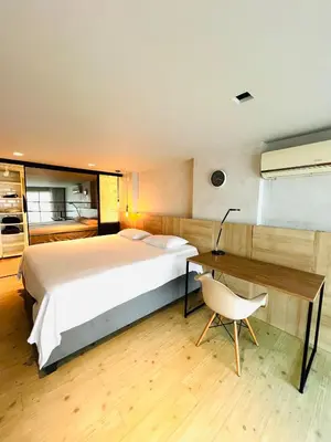 Uma cama ou camas num quarto em Loft com vista mar
