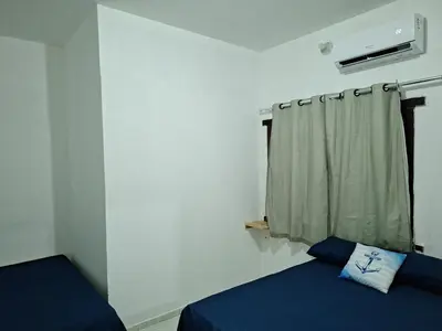 Uma cama ou camas num quarto em Mar Azul Casa de Praia