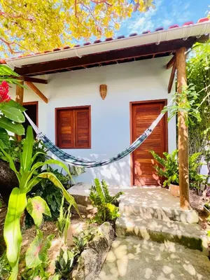 Um jardim no exterior de Recanto do cajueiro