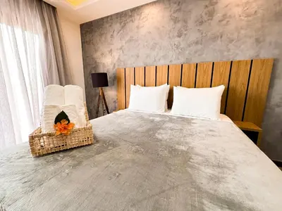 Uma cama ou camas num quarto em Aloha Palace Hotel