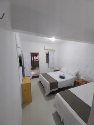 Uma cama ou camas num quarto em Jardim das Dunas