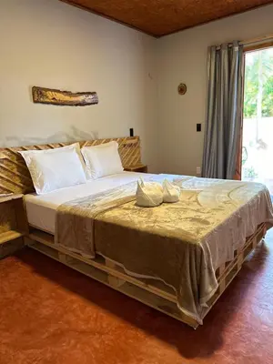 Uma cama ou camas num quarto em Windland Pousada Kite Center