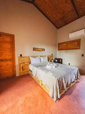 Uma cama ou camas num quarto em Windland Pousada Kite Center