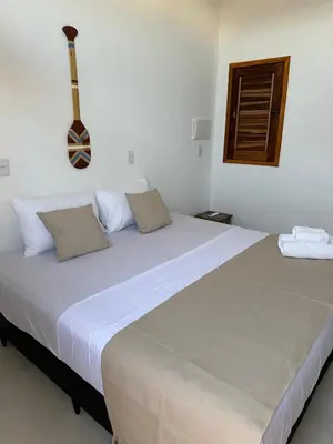 Uma cama ou camas num quarto em Flats Elementus Preá
