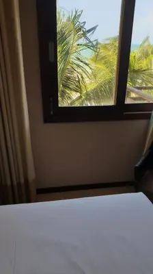 Uma cama ou camas num quarto em Seaview Beachfront Apartment 324 in Kariri Beach Residence Cumbuco