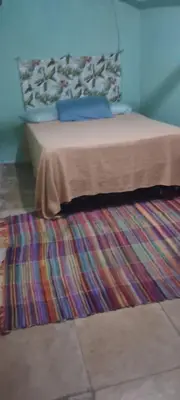 Uma cama ou camas num quarto em Vistamar Arco das Flores 2