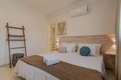 Uma cama ou camas num quarto em Kite Star - Apartamento moderno por Carpediem