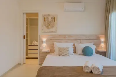 Uma cama ou camas num quarto em Kite Star - Apartamento no Cumbuco por Carpediem