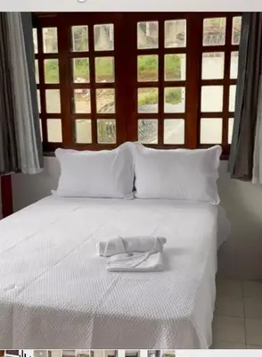 Uma cama ou camas num quarto em Encantu`s da Serra