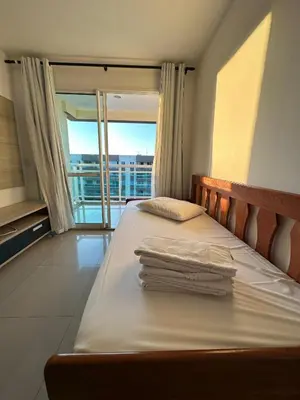 Uma cama ou camas num quarto em VG FUN Praia do Futuro AP 506 - 2 quartos 2 WCs - 60m2-IMOB TEMPORADA