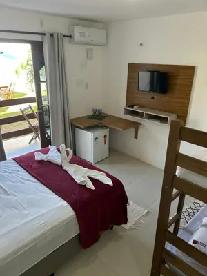 Uma cama ou camas num quarto em Pousada Lagoa Azul
