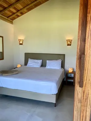 Uma cama ou camas num quarto em Casa do vento - Ilha do Guajiru