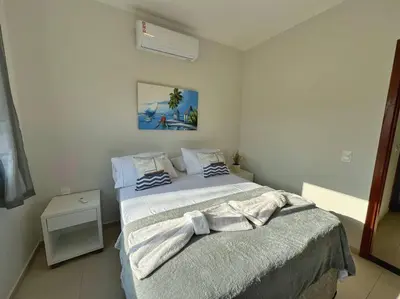 Uma cama ou camas num quarto em Canoa Quebrada, CE