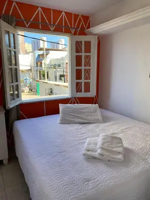 Uma cama ou camas num quarto em Pousada Oásis