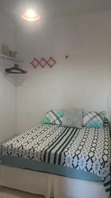 Uma cama ou camas num quarto em Chalé Rústico Fortaleza