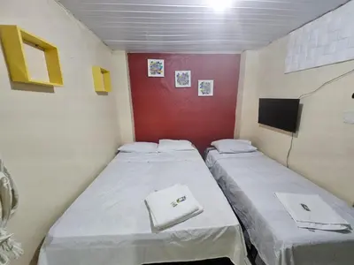 Uma cama ou camas num quarto em Pousada Mar de Iracema