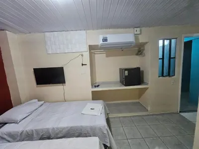 Uma cama ou camas num quarto em Pousada Mar de Iracema