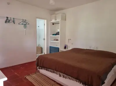 Uma cama ou camas num quarto em Vila jardim!