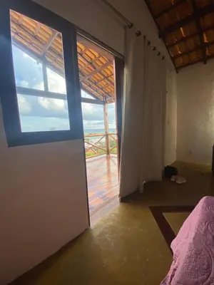 Uma cama ou camas num quarto em Praia da Baleia Vista Mar