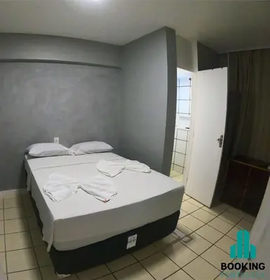 Uma cama ou camas num quarto em Estoril Praia de Iracema
